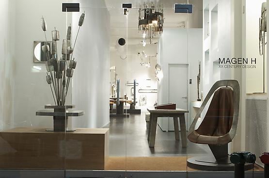 Alain Douillard exhibition at Magen H Gallery, installation view of the front window showing Douillard's mirror, &quot;Bouquet&quot; fontain, and leather chair
