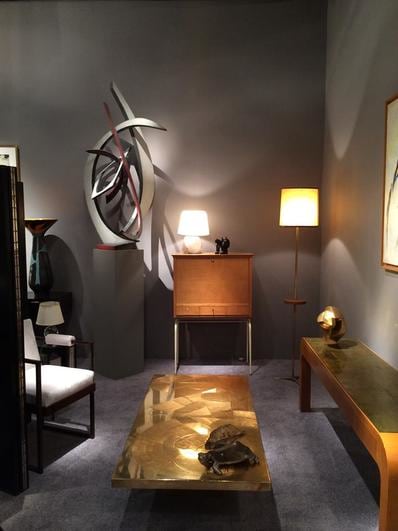 Magen H Gallery's booth at Winter Antiques Show, install image of Andr&eacute; Bloc's sculpture, Louis Sognot's secretary desk, and Armand Jonckers coffee table