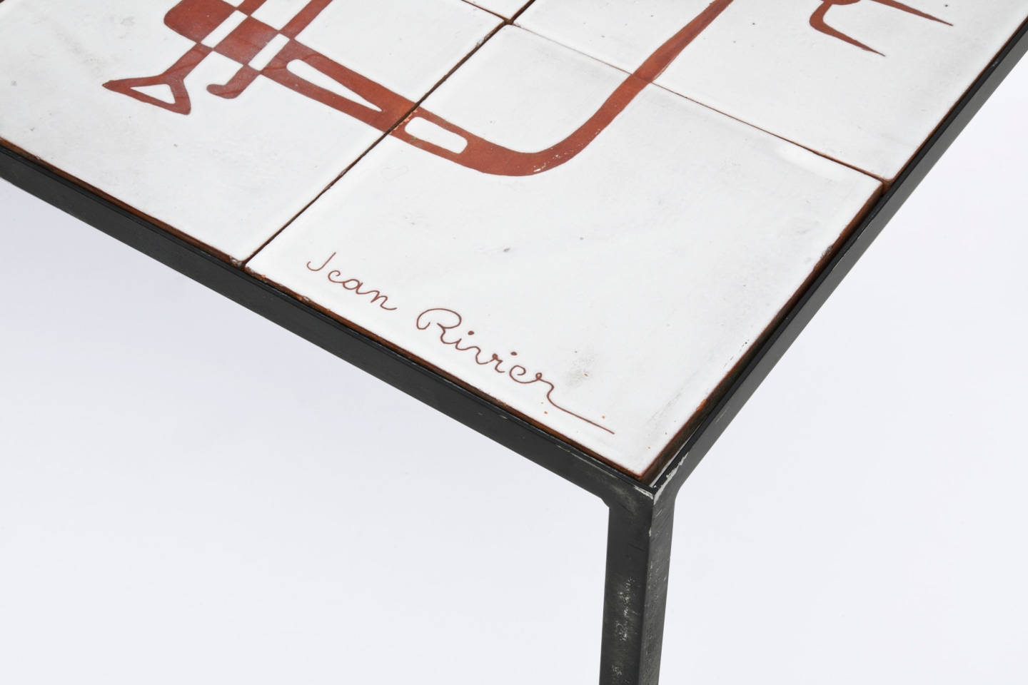Jean Rivier's ceramic coffee table, detailed view of signature on corner and metal legs