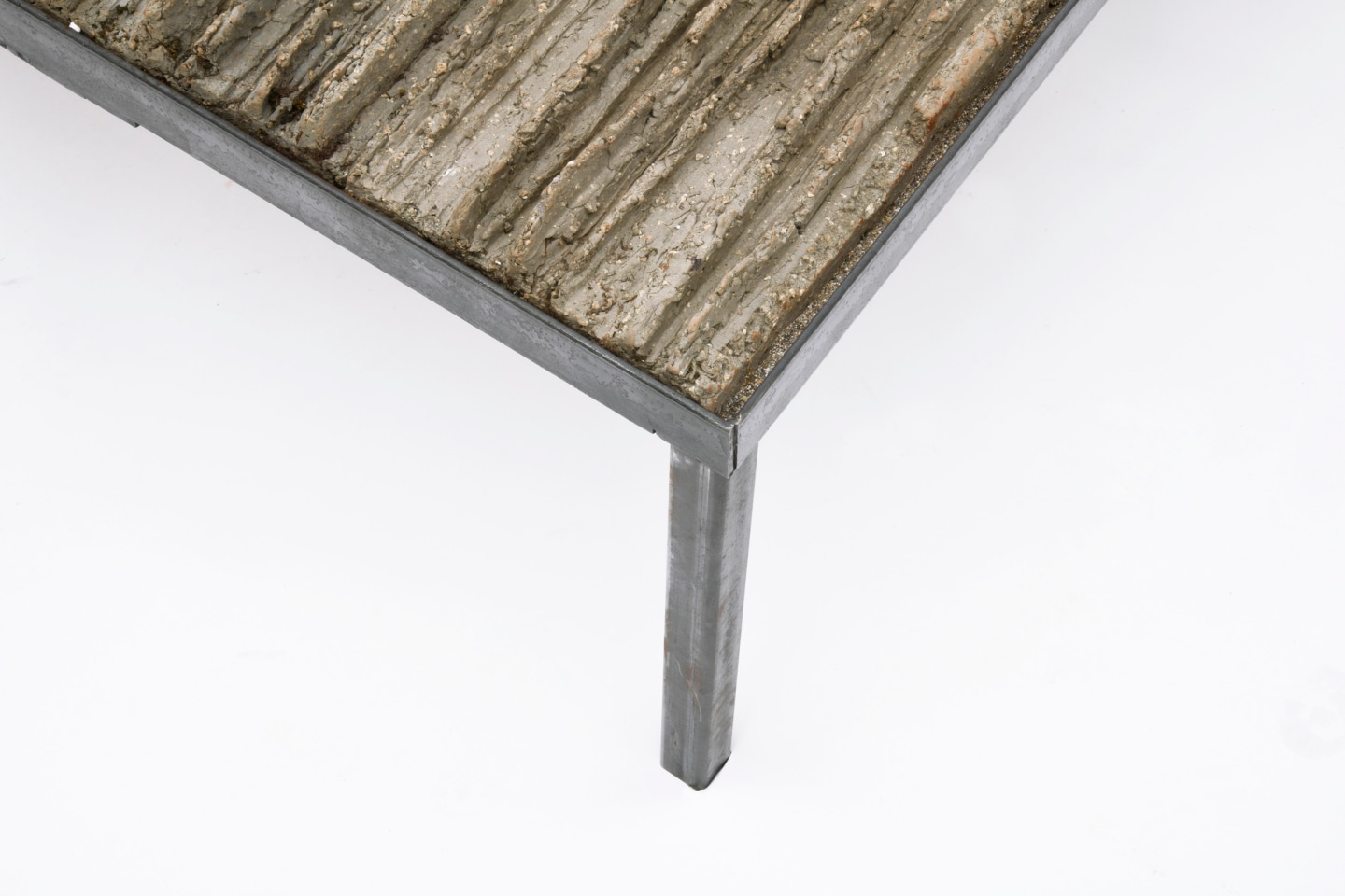 Anne Barr&egrave;s' coffee table detail of clay and metal leg