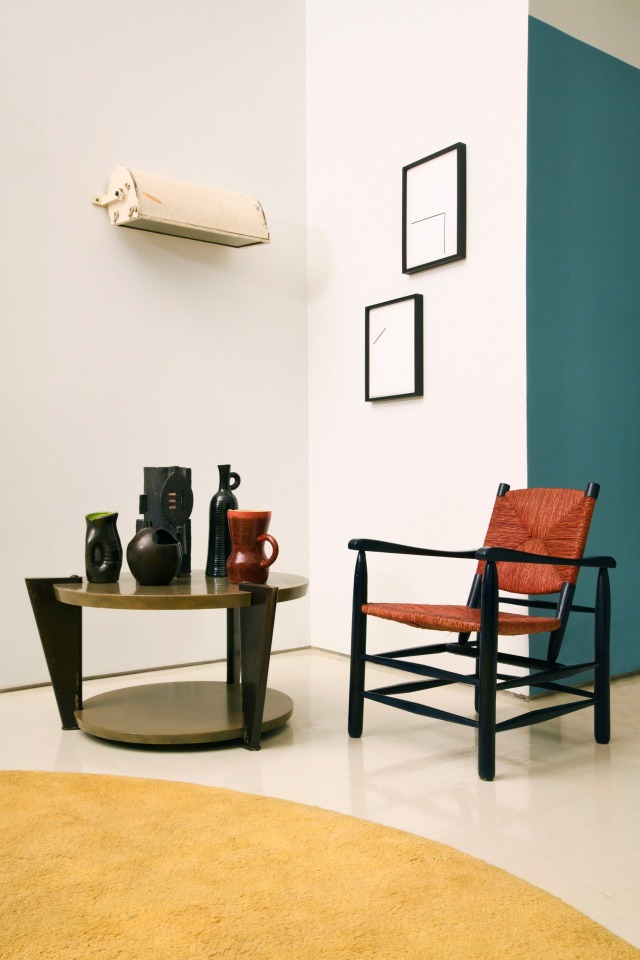 Michael Bargo's room | Pieces from left to right are Raymond Subes and Dominuqe's coffee table (c. 1960), Mado Jolain's ceramic pitcher (c. 1950), Suzanne Rami's ceramic vase (c. 1960), Bonnet's table lamp (c. 1970), Accolay's ceramic pitcher (c. 1950), Accolays red pitcher (c. 1960), Le Corbusier's &quot;LCII&quot; sconce (1949-52), Florian Pumh&ouml;sl's Modernology 27 and 29, and Charlotte Perriand's armchair  (c. 1950)