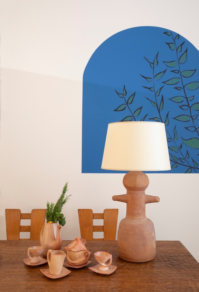 Installation view of exhibition. Pieces from left to right are Marolles' dining table, Henry Jacques Le M&ecirc;me set of 4 dining chairs, Vallauris' tea set, and Claude &amp; Jean Bersoux's table lamp