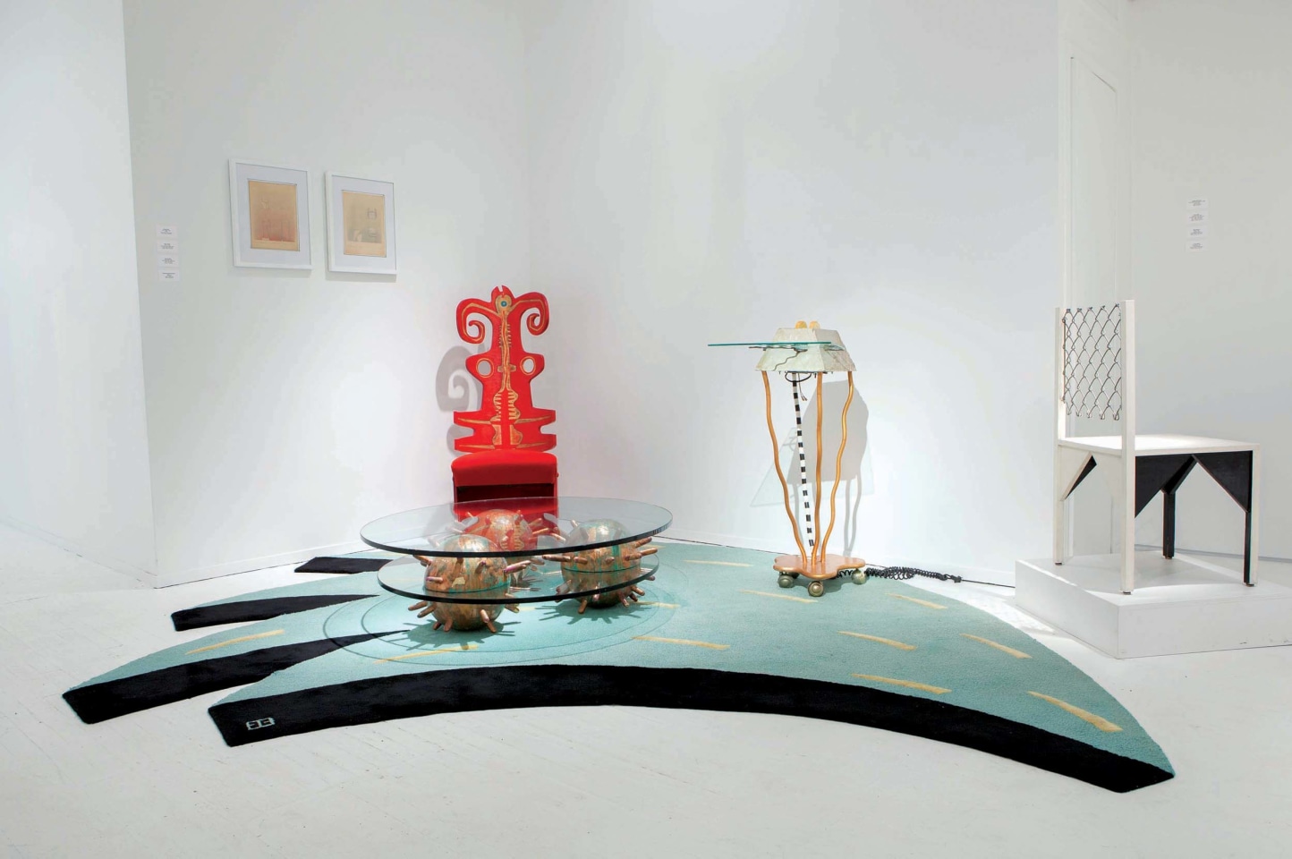 Art et Industrie exhibition installation view: Pieces from left to right are Elizabeth Browning Jackson's carpet, Terence Main's &quot;Red Twiddler&quot; chair, Alex Locadia's Toaster, and Paul Ludick's Apartheid Chair