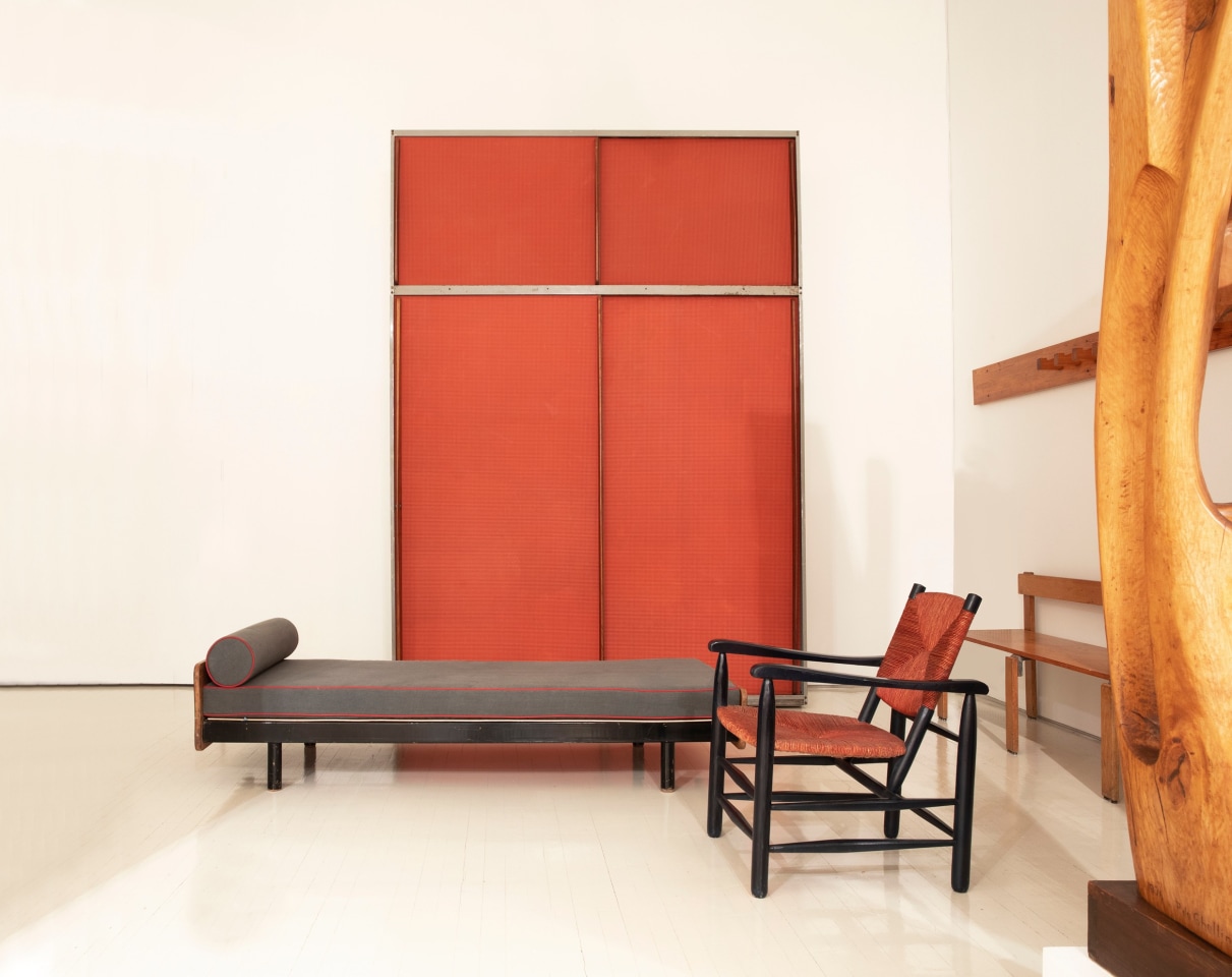 Installation view of exhibition. Piece from left to right are Jean Prouv&eacute;'s daybed and door panel, Charlotte Perriand's single armchair and coatrack, and Georges Candilis' bench