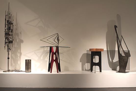 Alain Douillard exhibition at Magen H Gallery, installation view floor lamp, umbrella stand, Geometry #6 sculpture, side table, wood and metal stool, and freestanding mirror