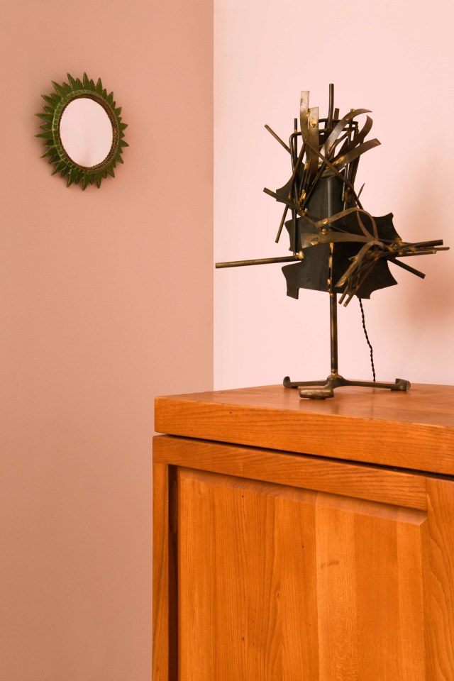 Robert Stilin's room | Pieces from left to right are Line Vautrin's &quot;Soleil a Pointes&quot; mirror (c. 1950), and a brutalist table lamp (c. 1960/70) on Pierre Chapo's &quot;R16&quot; sideboard (c. 1976)
