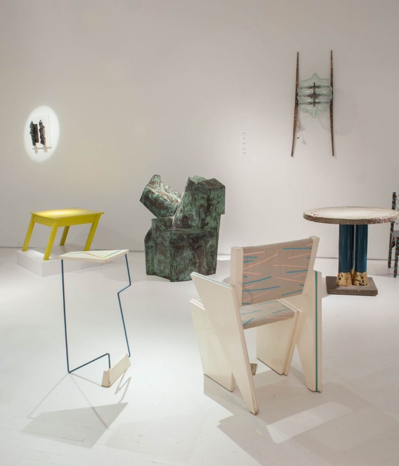 Art et Industrie exhibition installation view: Pieces from left to right are Michele Oka Doner's door handles, Rafael Barrios' Mesa table, James Evanson's trapezoid chair and side table, Carmen Spera's &quot;Cafe Rapido&quot; console table, and Terence Main's &quot;Amity&quot;