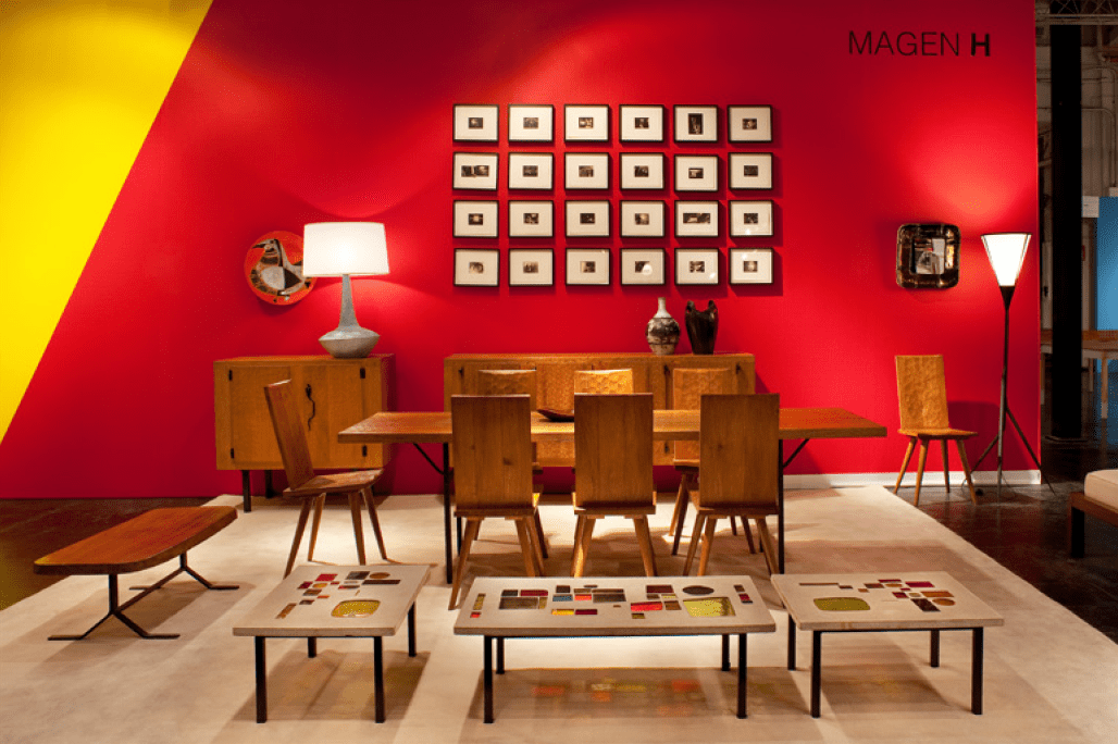 Magen H Gallery's booth at Collective Design Fair, showcasing Marolles' bench/coffee table, Marolles' sideboard, dining chairs, dining table, floor lamp and Jaques Avoinet's set of 3 concrete coffee tables