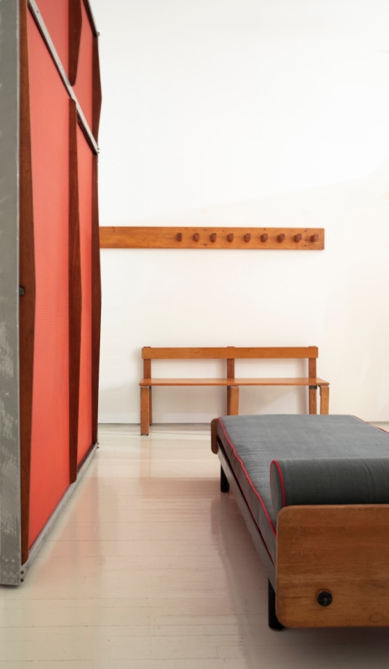 Installation view of exhibition. Piece from left to right are Jean Prouv&eacute;'s daybed and door panel, Charlotte Perriand's coatrack, and Georges Candilis' bench