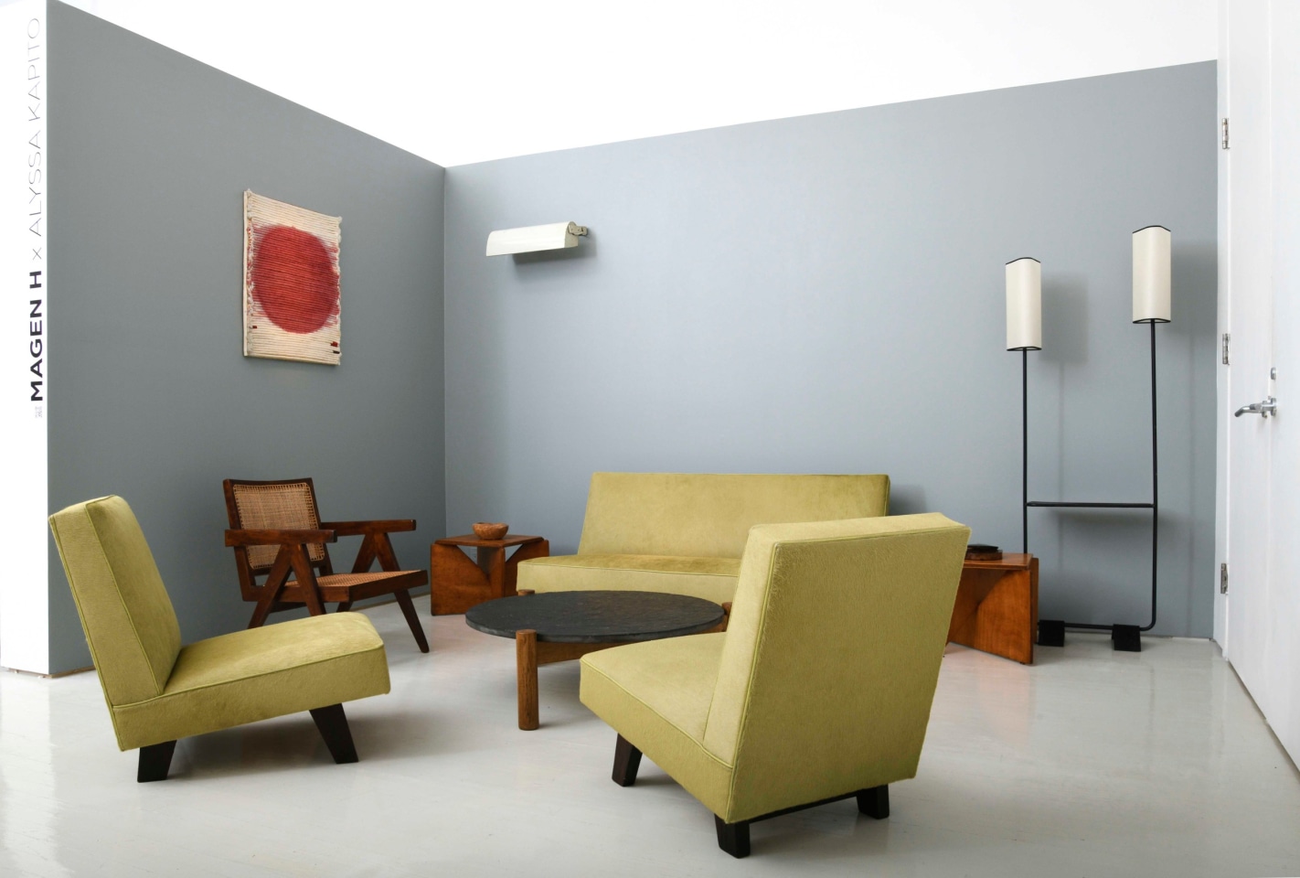 Alyssa Kapito's room | Pieces from left to right are Vera Cardot's &quot;Soleil Rouge&quot; painting (1971), Pierre Jeanneret's office chair (c. 1955-56), Le Corbusier's &quot;LCII&quot; sconce (1949-52), Alexandre Noll's wooden bowl (c. 1950), Le Corbusier, Pierre Jeanneret &amp; Jeet Lal Malhotra's &quot;Chief Justice&quot; three-piece suite (1955), Charlotte Perriand's coffee table (c. 1950), Herv&eacute; Baley's stool/side table (c. 1970), Alexandre Noll's cigarette box (1950), French floor lamp (c. 1950)