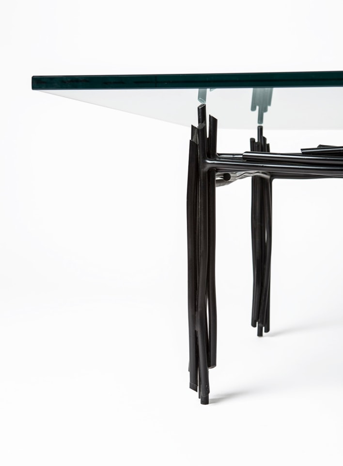 Howard Meister's painted metal coffee table, detailed view of one side of the table from eye-level view