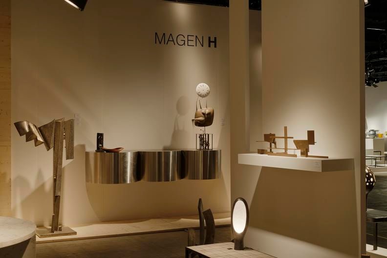 Magen H Gallery's booth at Design Miami/Basel, install view showing Philolaos Tloupas' sculpture, Guy de Rougemont &quot;Nuage&quot; console, Alexandre Noll's sculpture, Philippe Hiquilly's &quot;L'Horloge&quot; sculpture and Marino di Teana's metal sculpture