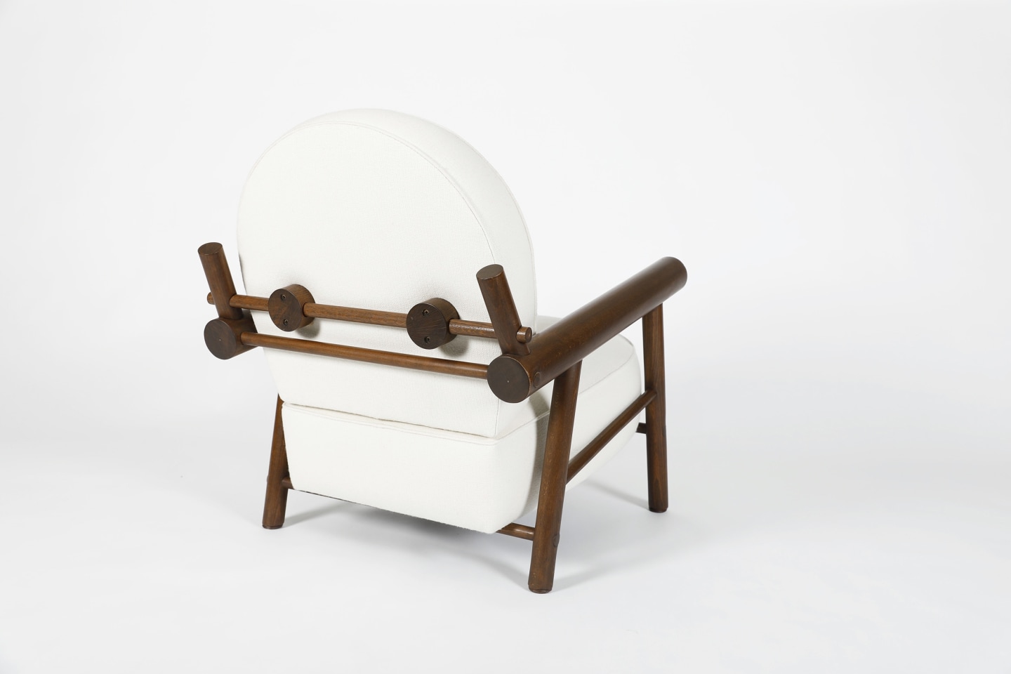 Attributed to Charlotte Perriand, pair of armchairs, single chair back diagonal view