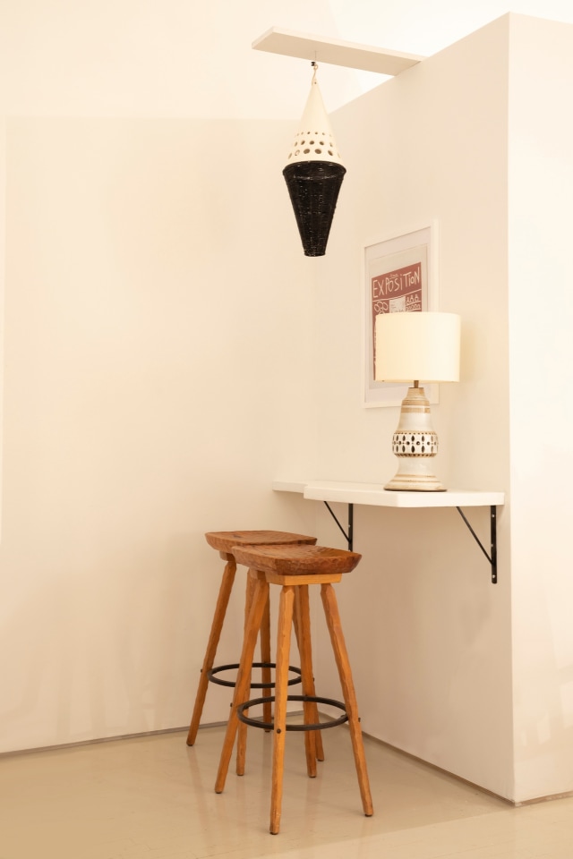 Installation view of exhibition. Pieces from left to right are Marolles' set of stools, Roger Capron's ceiling lamp, and Georges Pelletier table lamp