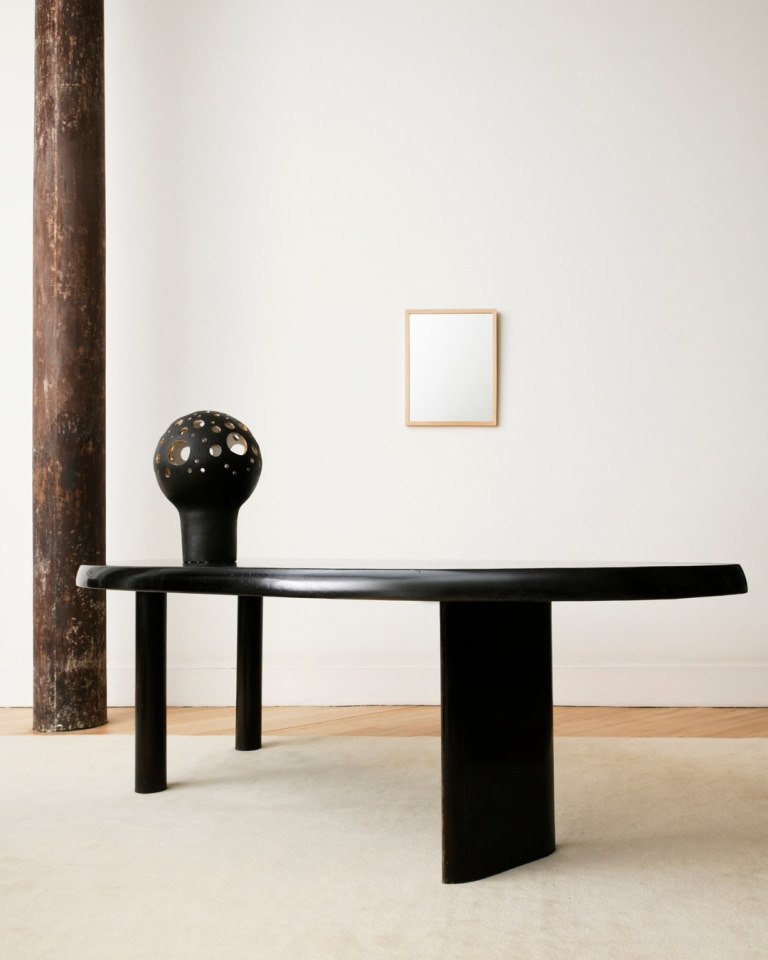Installation view of Andr&eacute; Borderie's ceramic table lamp with Charlotte Perriand's freeform dining table and Sherrie Levine's silver mirror in the back