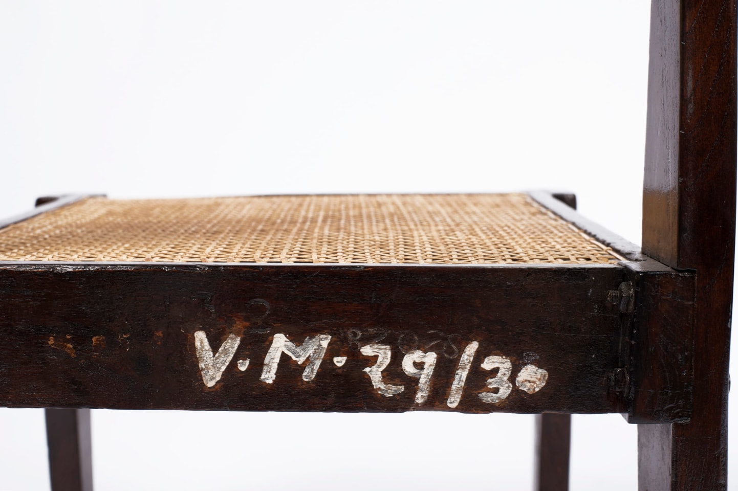 Pierre Jeanneret's pair of demountable chairs detailed view of marking on back of chair