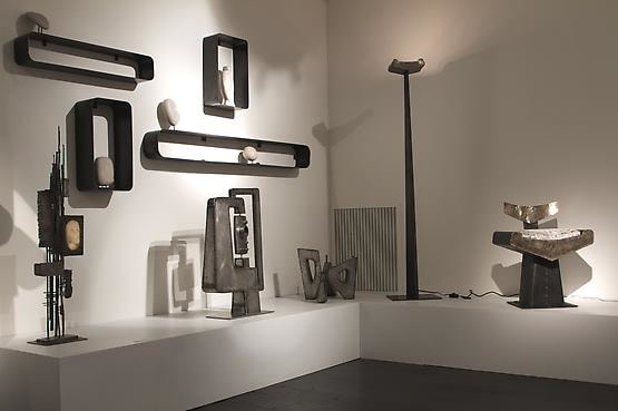 Alain Douillard exhibition at Magen H Gallery, installation view of Douillard's &quot;Coffrets&quot; sculpture, set of 5 shelves, &quot;Fleur&quot; sculpture, floor lamp, and chair