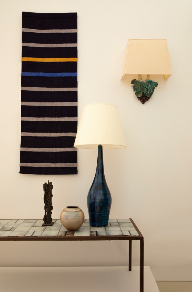 Installation view of exhibition. Pieces from left to right are Ilina Horning's tapestry, Mado Jolain's ceramic coffee table, Francois Stahly's sculpture, Robert &amp; Jean Cloutier's table lamp, Gustave Tiffoche's ceramic vase, and Alice Colonieu's sconce