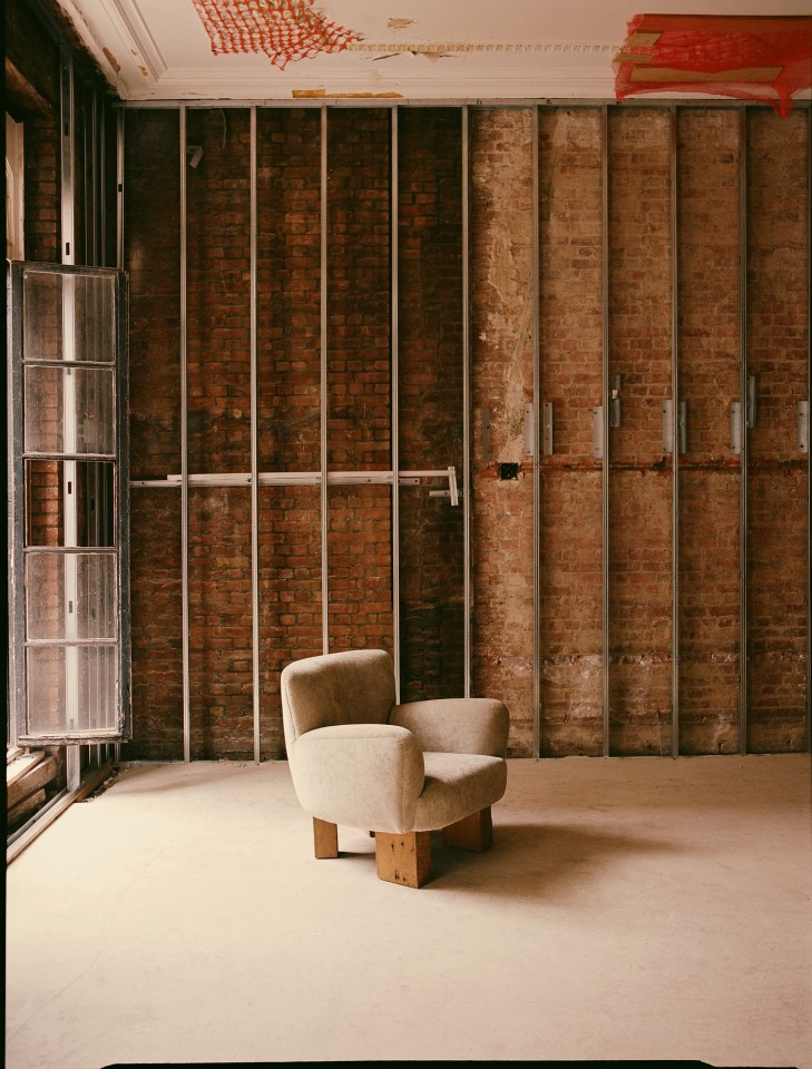 Studio Giancarlo Valle's puff chair with legs, full front diagonal view