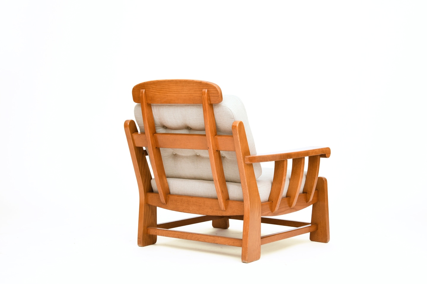 Maison Regain's pair of armchairs, back diagonal view of single armchair