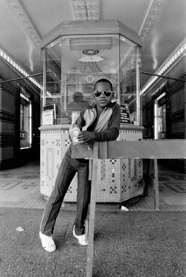 DAWOUD BEY, A Boy in Front of the Loew's 125th Street Movie Theatre, Harlem, NY, 1976