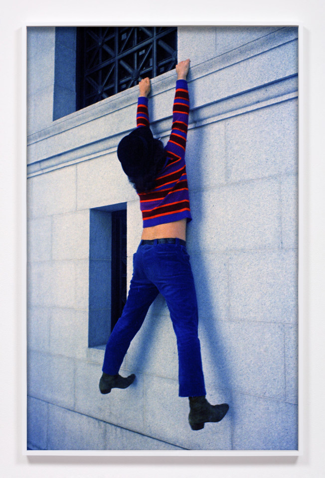 Ron Rakow, Jerry Garcia hanging off the Pacific Stock Exchange Building, San Francisco, CA, 1967 / 2025