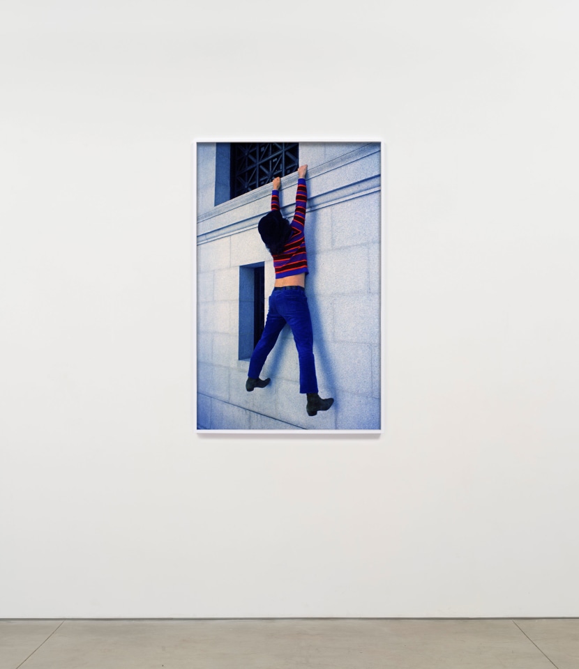 Ron Rakow, Jerry Garcia hanging off the Pacific Stock Exchange Building, San Francisco, CA, 1967 / 2025