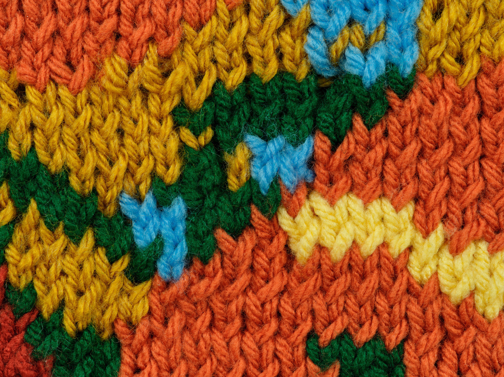 Detail of knit stitches in Grant Levy Lucero's "Vase of Ten Sunflowers", 2025