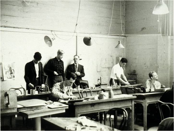 Clay Spohn in the studio with a class, student Jeremy Anderson stands on his right, c. 1948.