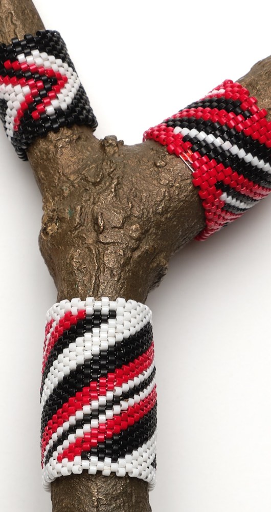 Saif Azzuz To be present, 2022 Glass beads on bronze 8 1/2 x 2 3/4 x 1 1/2 inches 21.6 x 7 x 3.8 cm