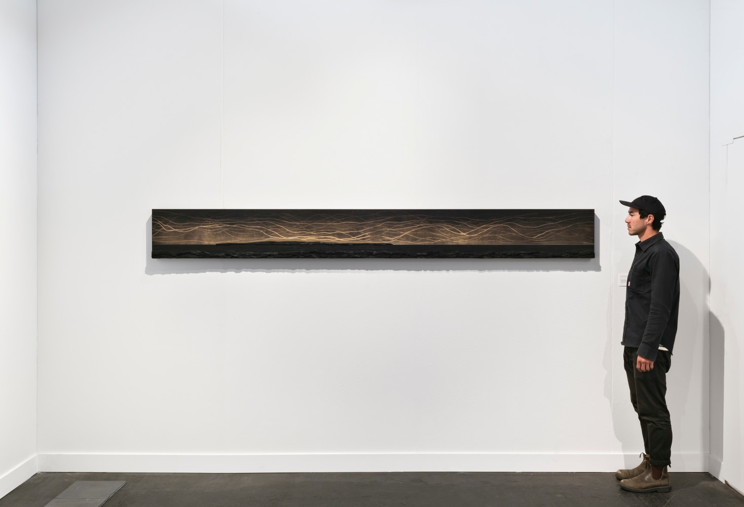 Teresita Fernández Dark Earth (Mirage), 2019 Solid charcoal and mixed media on chromed panel 12 x 108 x 2 inches 30.5 x 274.3 x 5.1 cm