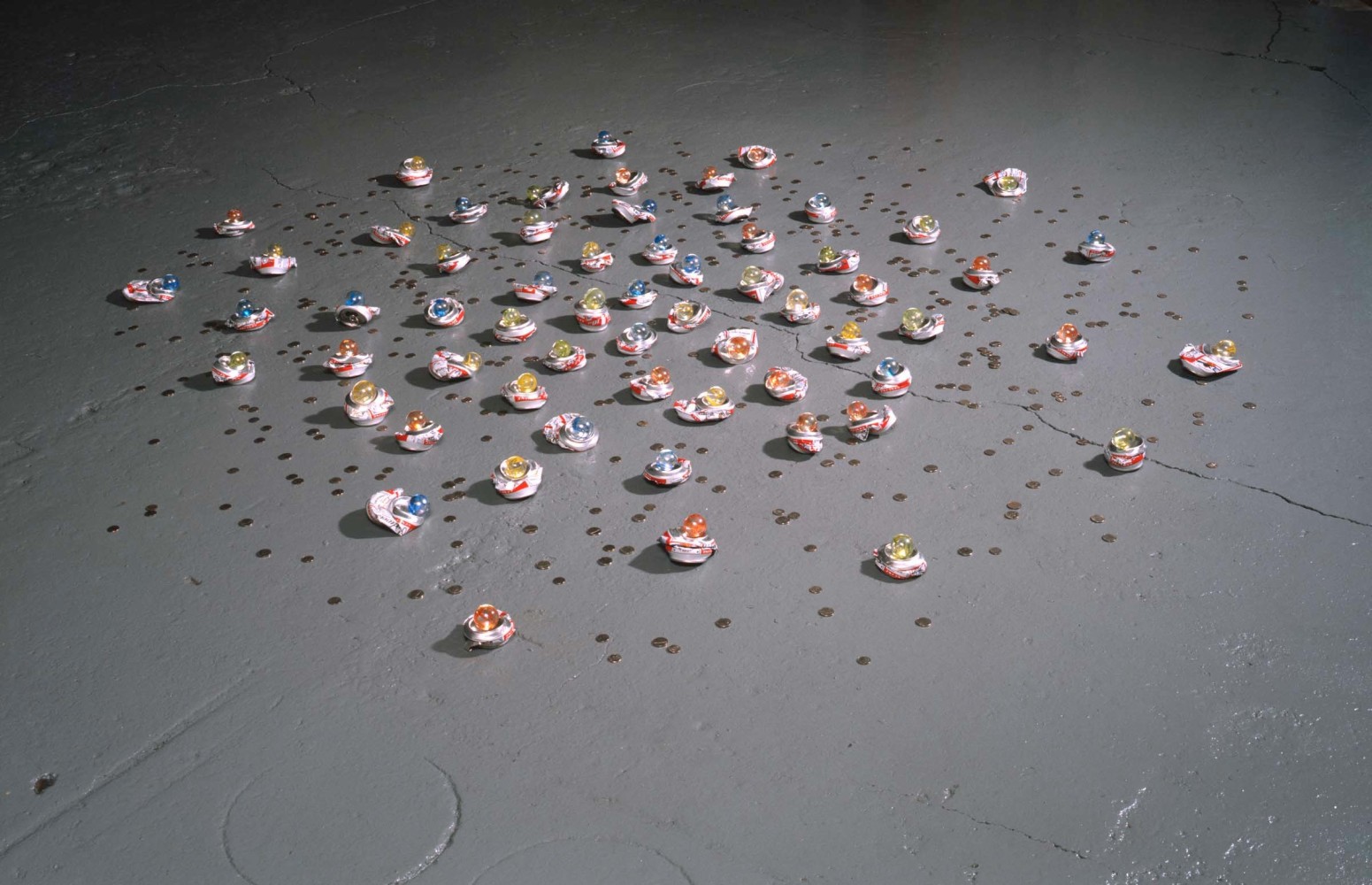 Tony Feher (Constellation), 2007 Accompanied by an artist's certificate. Aluminum cans, glass marbles, nickels and dimes 2 1/2 high x 88 inches in diameter 6.4 high x 223.5 cm in diameter