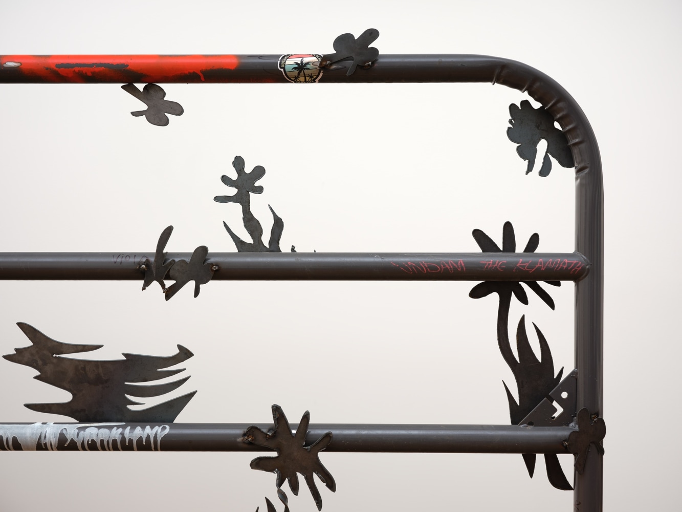 Saif Azzuz Who says, 2022 Stickers, ink, bungee cord, chains, and steel 59 x 93 inches 149.9 x 236.2 cm