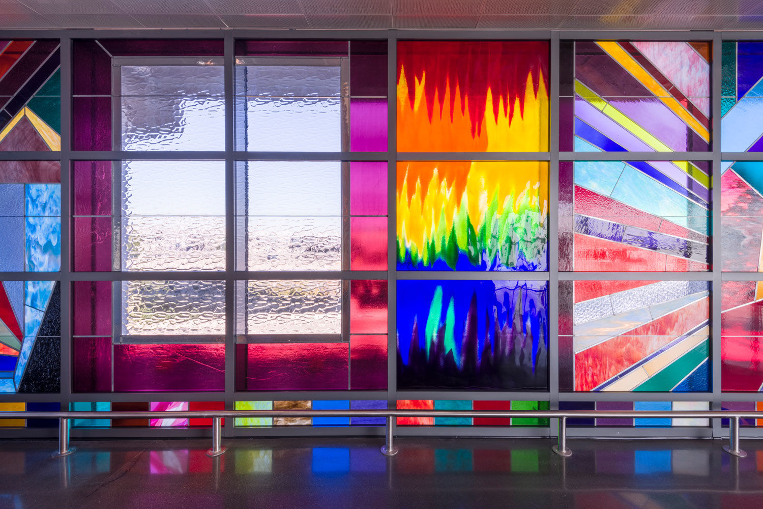 Sarah Cain Detail view of We Will Walk Right Up To The Sun, 2019 Stained glass framed by soldered zinc 10 x 150 feet Produced by the San Francisco Arts Commission  for the AirTrain station at San Francisco International Airport