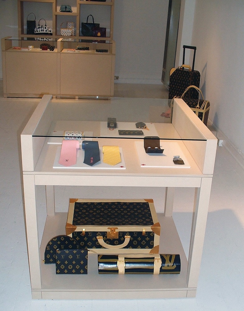 Libby Black Installation view from Luis Vuitton Store, 2003 Paper, acrylic, MDF, and glass Dimensions variable