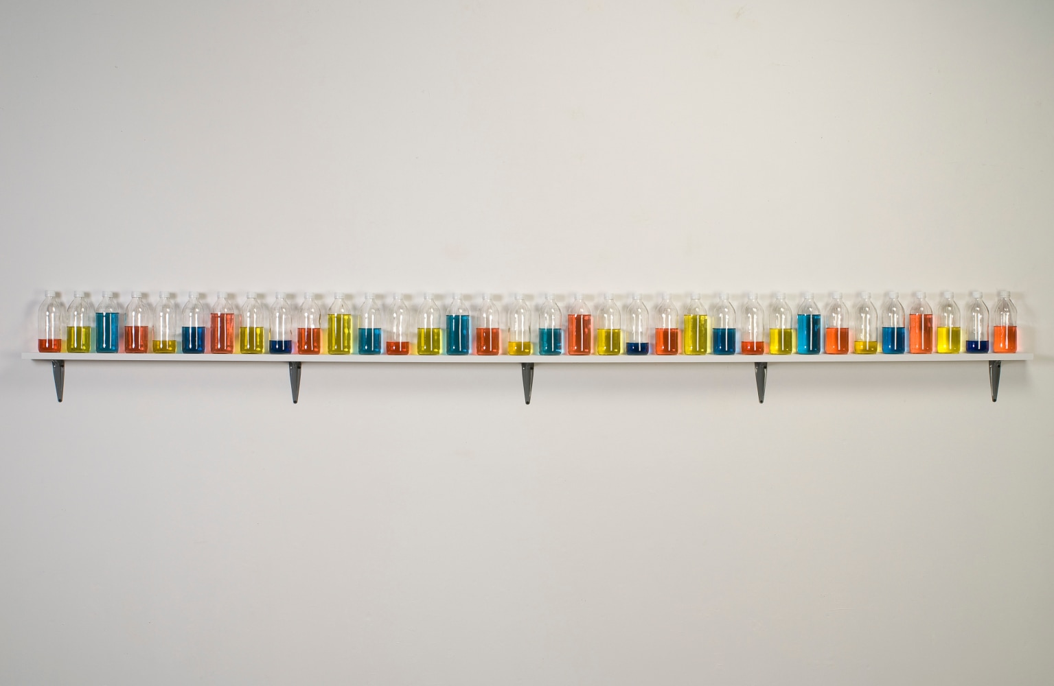 Tony Feher (Chanting One), 2008 Signed on shelf verso 34 glass bottles with screw caps, water, food color and painted wood shelf 8 1/4 x 120 1/2 x 3 1/2 inches 21 x 306.1 x 8.9 cm