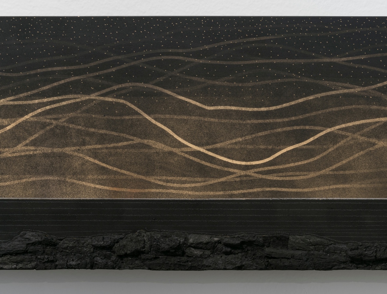 Teresita Fernández Dark Earth (Mirage), 2019 Solid charcoal and mixed media on chromed panel 12 x 108 x 2 inches 30.5 x 274.3 x 5.1 cm