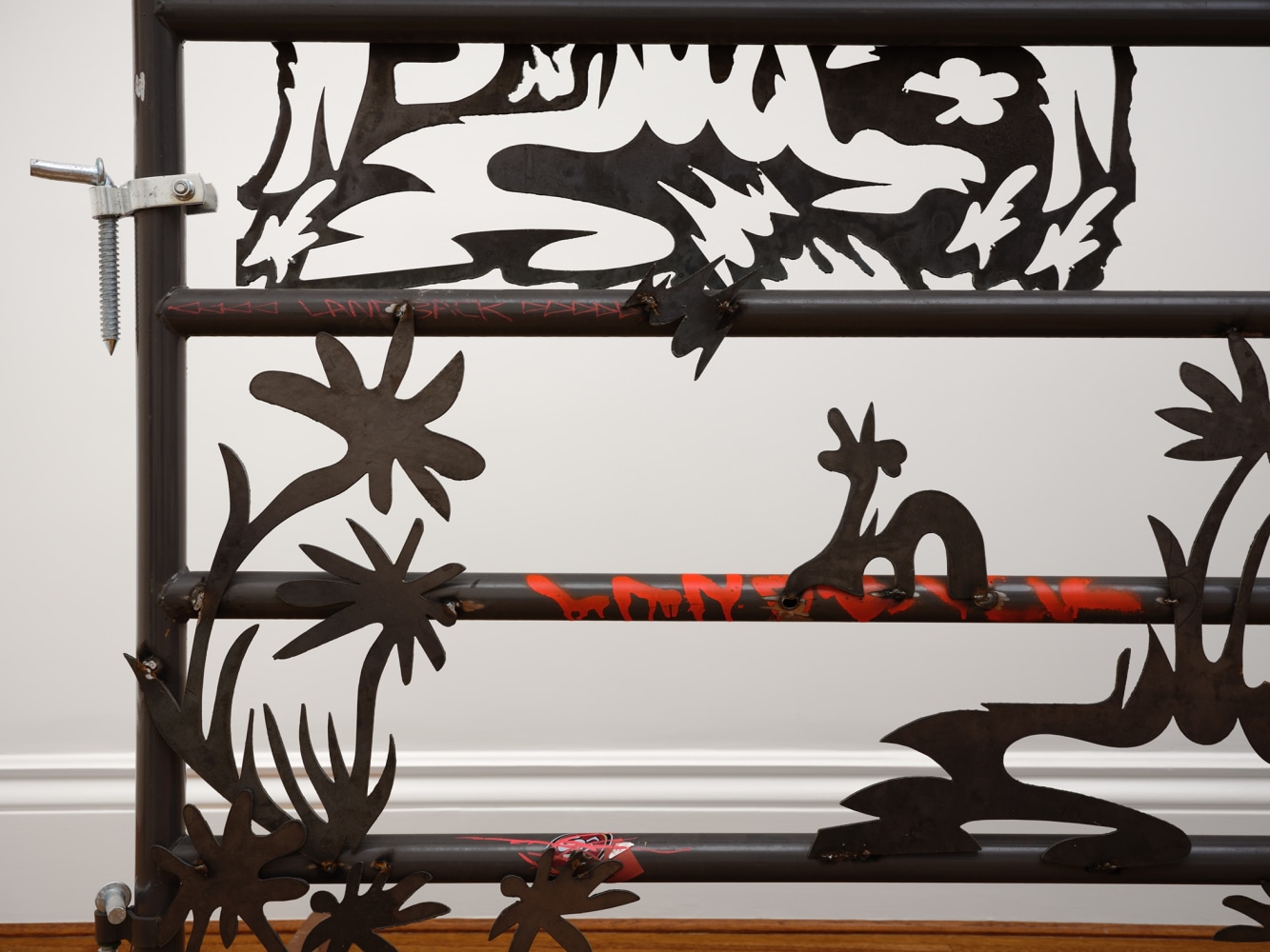 Saif Azzuz Who says, 2022 Stickers, ink, bungee cord, chains, and steel 59 x 93 inches 149.9 x 236.2 cm