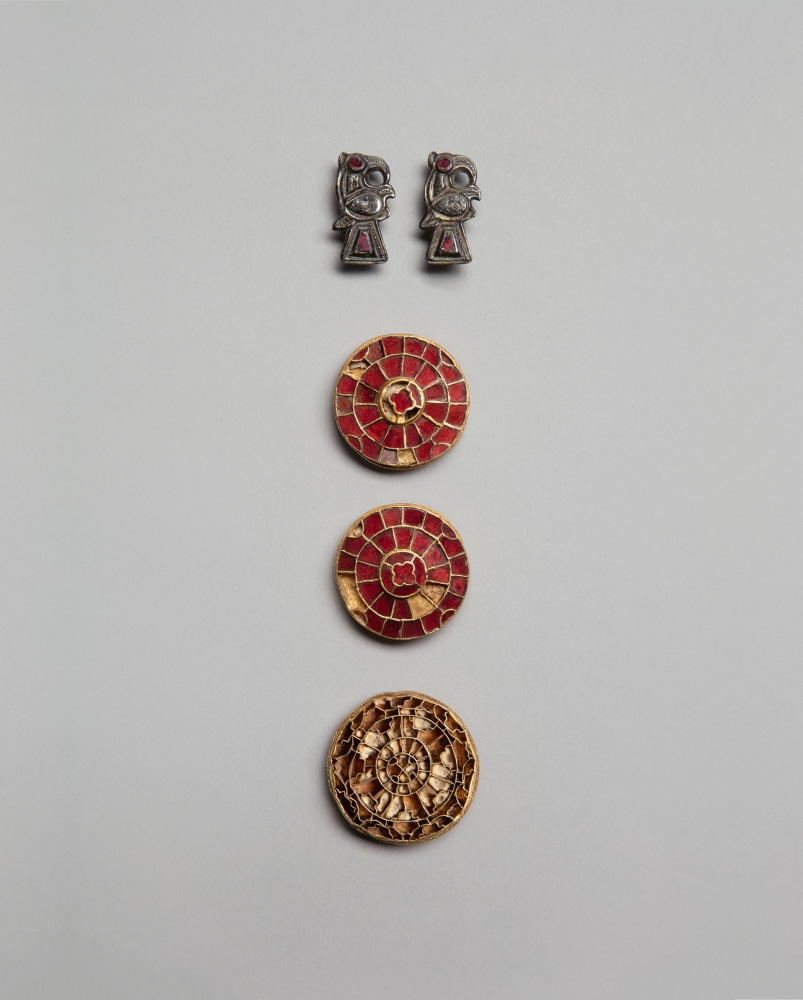 A group of Merovingian brooches from the collection of the Comtesse de Behague (1870-1939), c. 580-600
France
Garnet brooches: 1.6 in (4 cm) (diameter); gold, garnet, cement, copper alloy
Disk brooch: 1.7 in (4.4 cm) (diameter); gold, cement, copper alloy
Bird brooches: 1.3 x .7 in (3.3 x 1.8 cm); silver, gilding, garnet