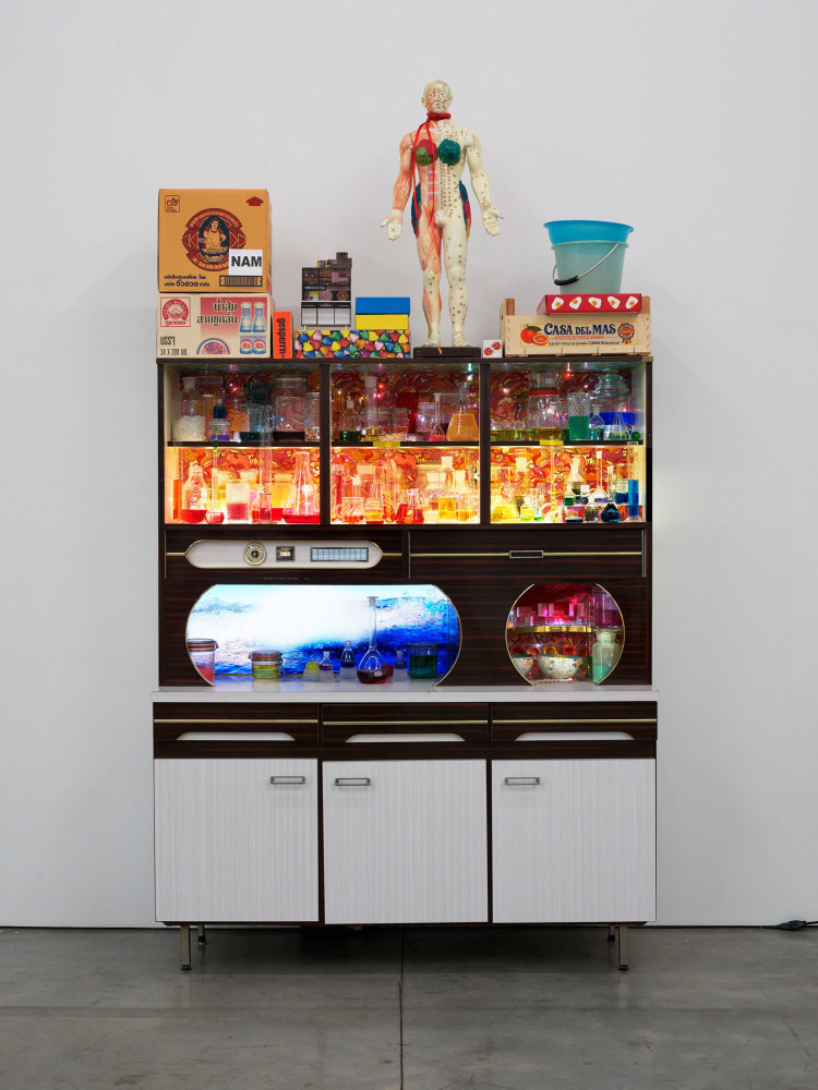 Pipilotti Rist
Tosender Speicher (Thunderous Accumulator), 2013
Video installation; 1 LCD monitor, 1 flashcardplayer, 1 vintage sideboard in laminated wood, miscellaneous objects, LED lights, laboratory glassware with synthetic resin
108 5/8 x 59 x 22 7/8 inches
(276 x 150&amp;nbsp;x 58&amp;nbsp;cm)