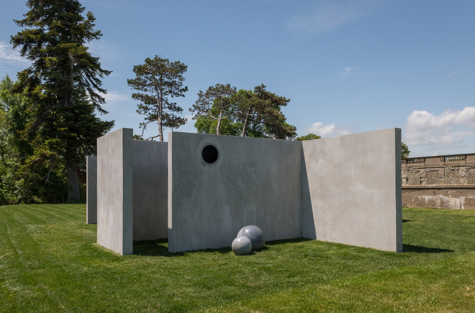 Alicja Kwade
TunnelTeller, 2018
Stainless steel, concrete, natural stone (Macauba azul)
Site specific installation for The Trustees&amp;rsquo; Castle Hill on the Crane Estate
Photo: Peter Vanderwarker Photography

&amp;nbsp;