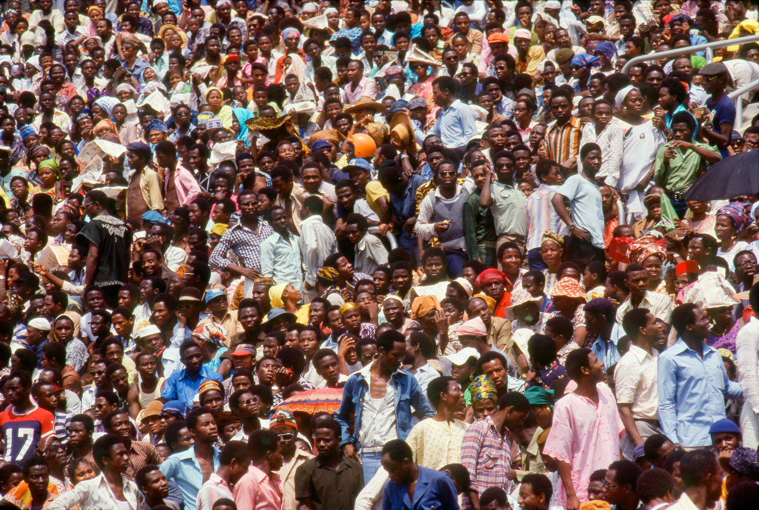 Roy Lewis (b. 1937)
The Crowd at National Stadium on Opening Day of FESTAC, 1977
Archival inkjet print on Simply Elegant Gold Fibre paper
Image: 13 3/4 x 20 inches (34.9 x 50.8 cm) Sheet: 17 x 22 inches (43.2 x 55.9 cm)
Framed: 18 5/8 &amp;times; 25 3/8 &amp;times; 1 1/2 inches (47.3 &amp;times; 64.5 &amp;times; 3.8 cm)
Edition of 5, printed 2023