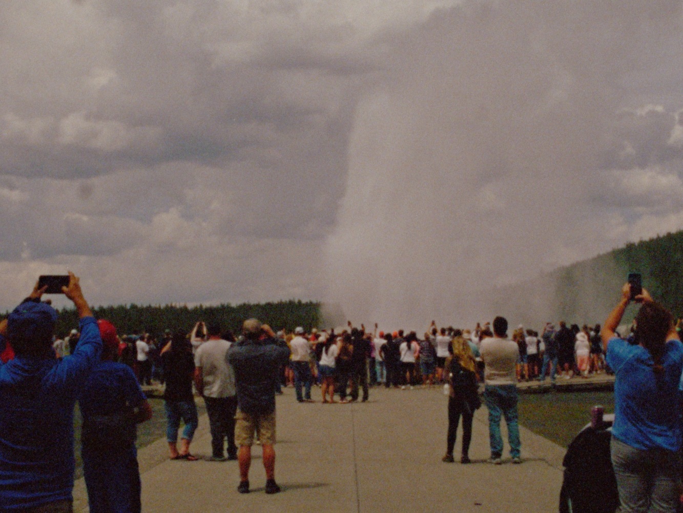 A still from a video shot on 16mm of Old Faithful geyser erupting.