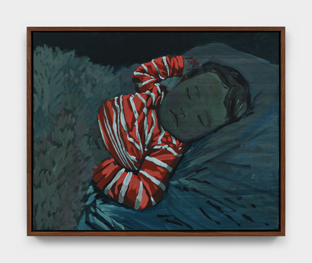 A portrait in deep blue hues of a child asleep in bed wearing a red and white striped top.