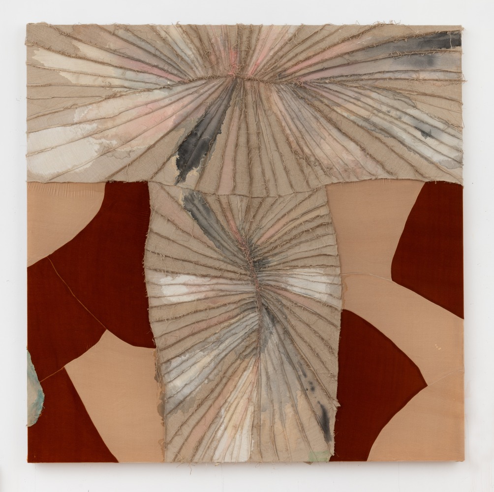 A painting with sewn segments gathered in the center with two toned brown panels zig zagging on the side.