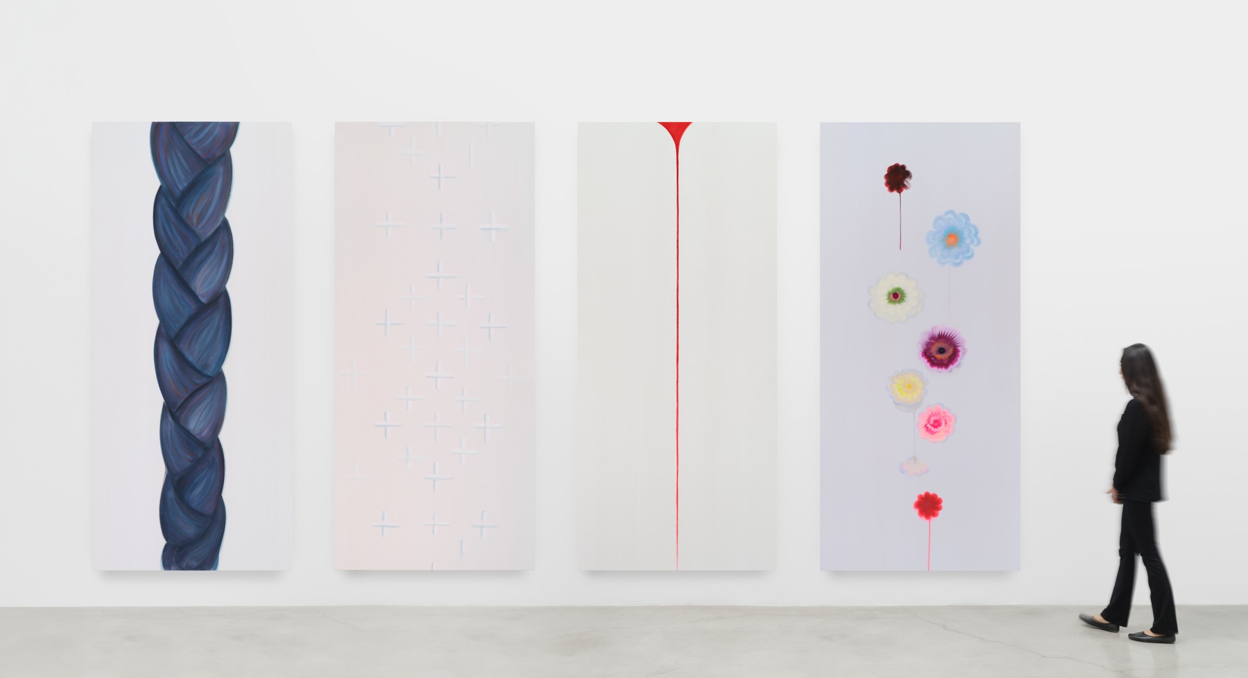 An installation view of Wanda Koop's &quot;Sleepwalking&quot; which is divided into four vertical panels. The left panel depicts a braid, the next panel is light pink with small white crosses, the next panel is white with a thin red bloodline running through the center, and the last panel has multi colored flowers floating across the surface