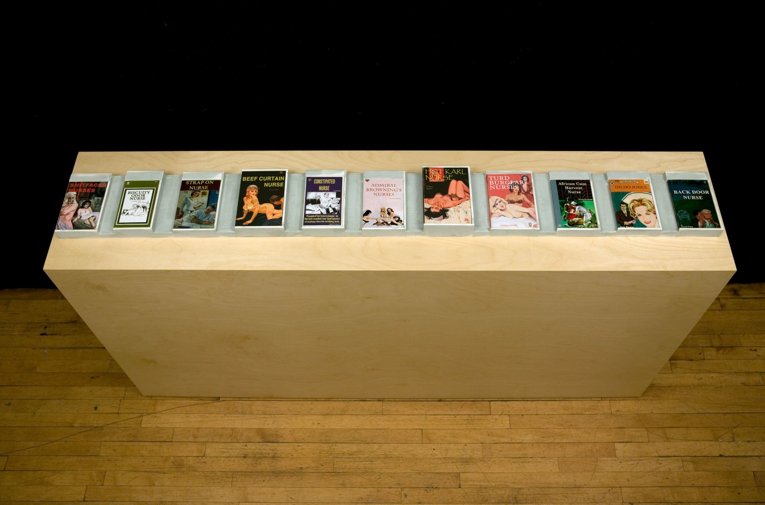 Bad Nurse, 2008&amp;nbsp;
Sculpture with 11 books mounted in custom tray with pedestal
Book Tray: 8 1/2&amp;nbsp;x 77 x 2 inches
Pedestal: 79 x 17 1/2&amp;nbsp;x 39 3/4 inches
Edition of 2