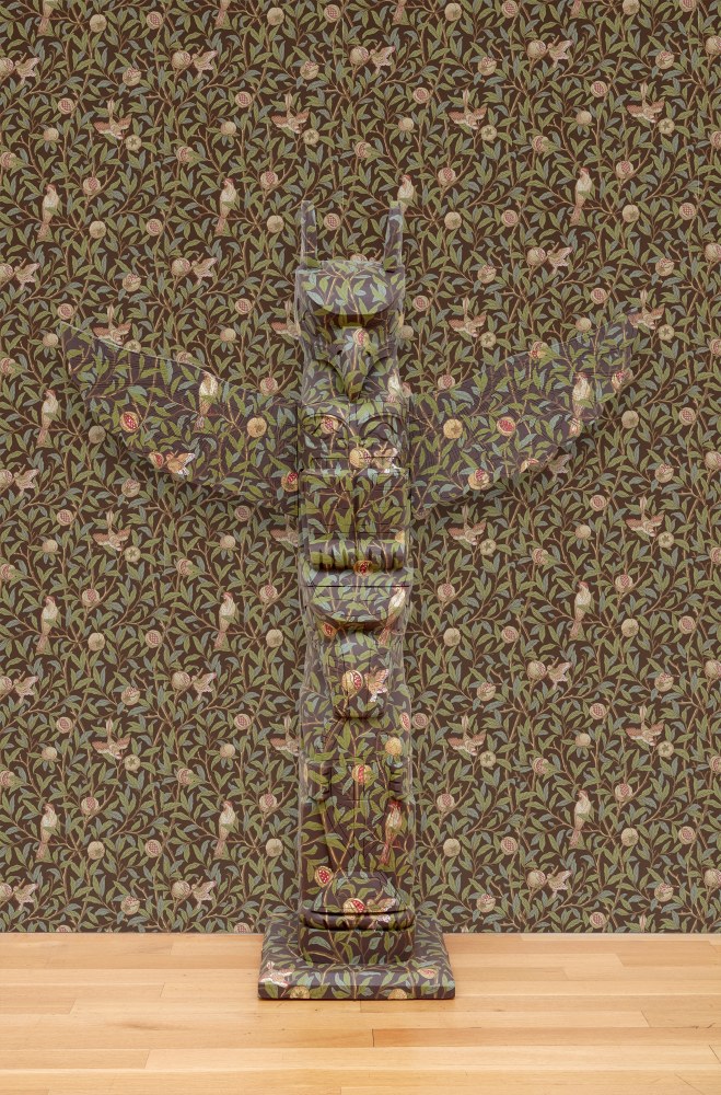 Nicholas Galanin

The Imaginary Indian (Orientalism, after E.W. Said), 2025

Indonesian replica of a Ling&amp;iacute;t totem with Victorian wallpaper

Installation dimensions variable
Totem: 79 1/2 x 51 1/2 x 19 1/4 inches (201.9 x 130.8 x 48.9 cm)

(NGA25-03)