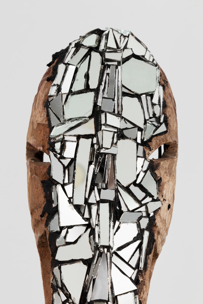 Kader Attia
Mirror Mask (detail)
2020
Wooden mask, mirror fragments, black pigment
Artwork Dimensions:
22 x 8 1/4 x 6 1/4 inches (56 x 21 x 15.8 cm)
Overall Dimensions:
70 x 8 1/4 x 10 inches (177.8 x 21 x 25.4 cm)