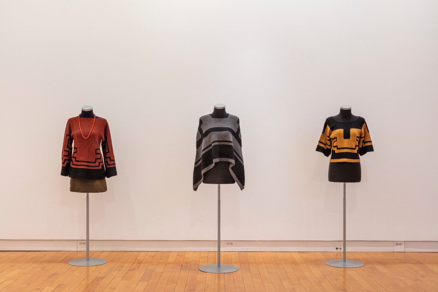 A-Z Personal Uniform, 2nd Decade: Fall/Winter 2011/2012 #1 - #3 (detail of A-Z Personal Uniforms: Fall/Winter 2003 through Spring/Summer 2013)
2011
Comprised of 1 rust and black woven tunic, 1 green woven short skirt, 1 red wooden bead necklace, 1 dark grey and black crochet cape, 1 yellow and black crochet short-sleeve shirt

Dimensions variable